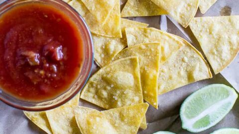 Bake your own Homemade Tortilla Chips in 10 minutes! Extra thin tortillas ensure crunchy snacks every time, perfect for salsa and guacamole.