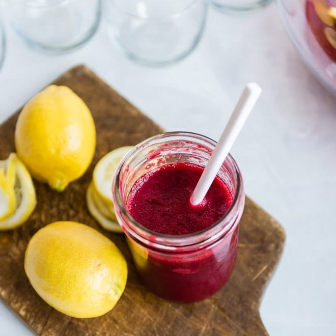 Raspberry lemonade fizz in a clear glass.