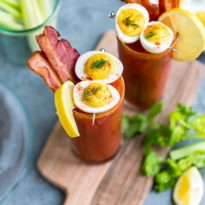 Two bacon and eggs bloody Mary cocktails.