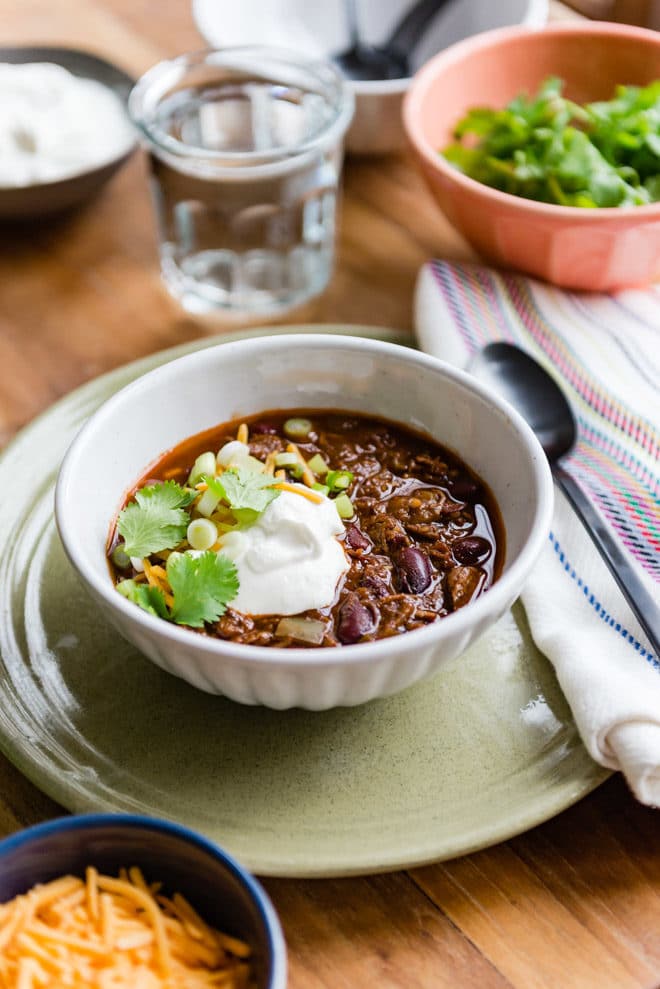 A delicious, easy recipe for Slow Cooker Chili Con Carne. Find all my tips and tricks for adding the most flavor to your chili every step of the way!
