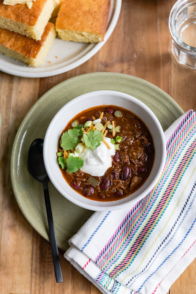 A delicious, easy recipe for Slow Cooker Chili Con Carne. Find all my tips and tricks for adding the most flavor to your chili every step of the way!