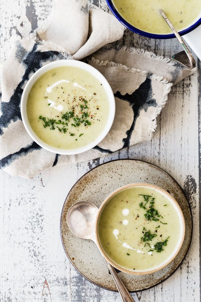 Two bowls of potato leek soup.