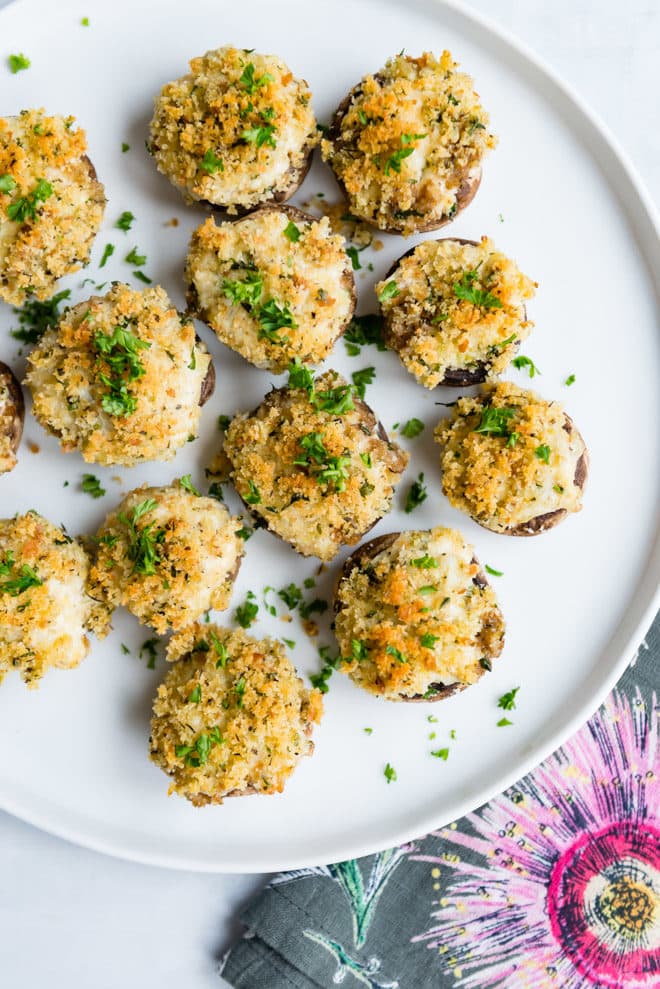 Mushroom lovers rejoice! These vegetarian Stuffed Mushrooms are loaded with marinated artichoke hearts, two cheeses, and scallions. Top them off with buttery breadcrumbs, then bake until golden brown and bubbly! Everything can be prepped and assembled the day before (in 30 minutes or less!).