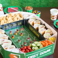 Elevate your Game Day entertaining with an epic Snack Stadium! Use a store-bought stadium kit so you can focus on the most important part: THE SNACKS!