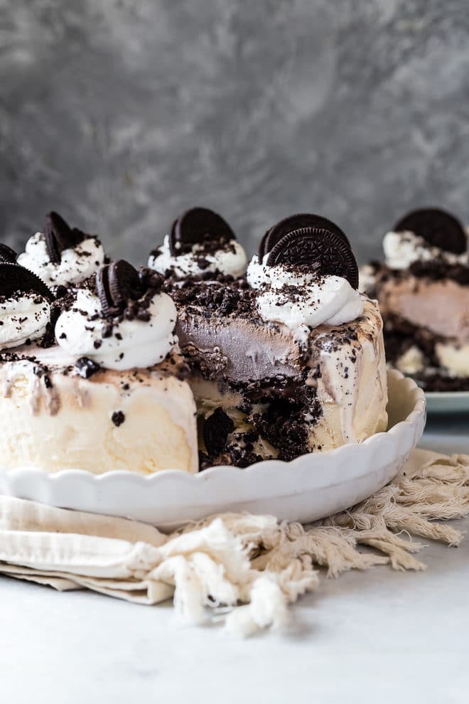 An easy ice cream cake with one piece cut from it.