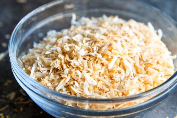 Learn how to toast coconut two different ways: In the oven and on the stove in a skillet. Works for shredded or shaved coconut, sweetened or unsweetened!