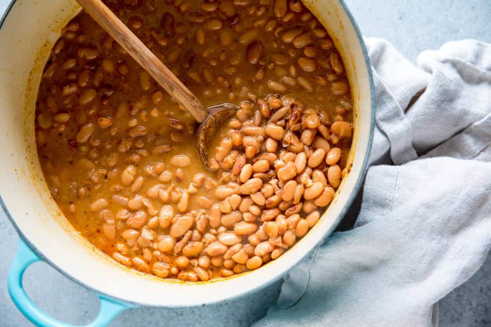 These copycat Chipotle Pinto Beans are easy to make, inexpensive, and healthy! Add to burritos and salads or serve with rice for a tasty vegetarian meal.