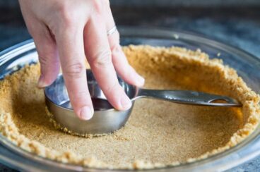 Learn how to make a Graham Cracker Crust from scratch! The homemade version is sweet, buttery, and miles ahead of anything you can buy at the store.