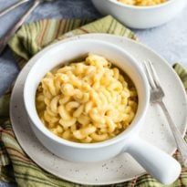 Healthy mac and cheese in a white bowl.