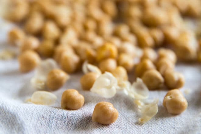 Chickpeas on a towel with the skins removed.