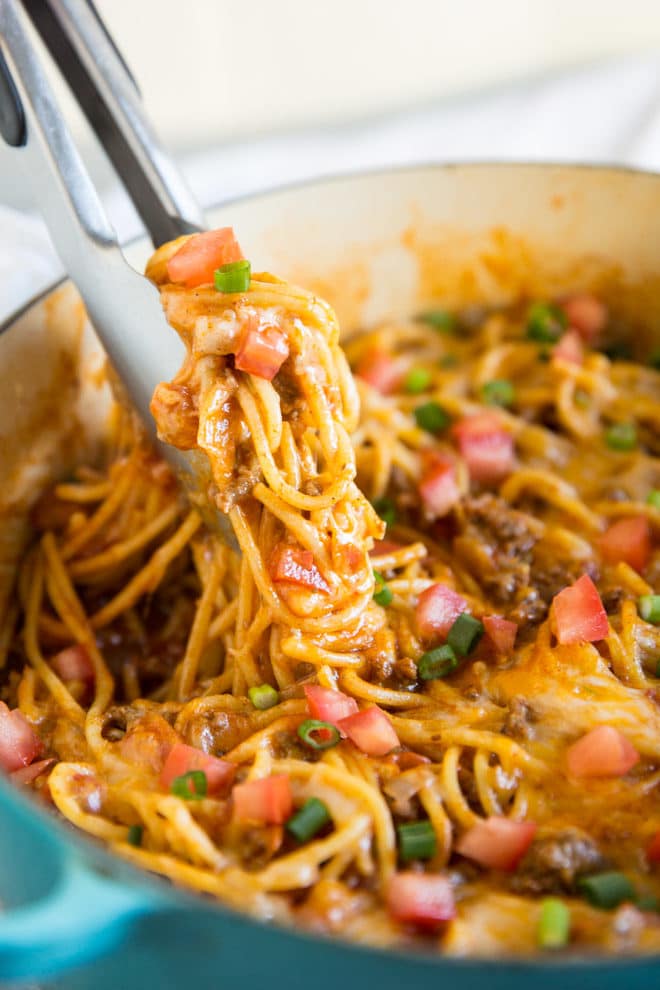 Taco Spaghetti is fast, easy, and comes together in 30 minutes or less - all in one pot. The juice from the tomatoes and the added liquid cooks the spaghetti to perfection and creates its own taco-seasoned sauce. Tasty, satisfying, and delicious, you can even make baked spaghetti pie with the leftovers. That is, if you have any!