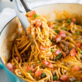 Taco Spaghetti is fast, easy, and comes together in 30 minutes or less - all in one pot. The juice from the tomatoes and the added liquid cooks the spaghetti to perfection and creates its own taco-seasoned sauce. Tasty, satisfying, and delicious, you can even make baked spaghetti pie with the leftovers. That is, if you have any!