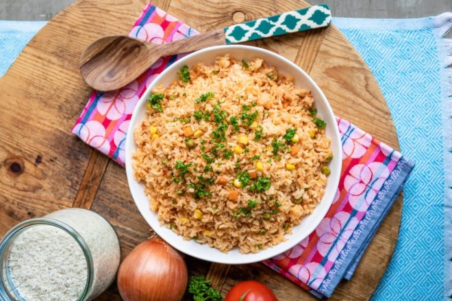 Spanish rice in a white serving bowl.