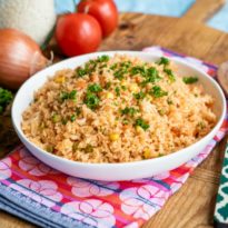 Spanish rice in a white serving bowl.