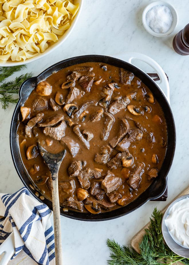 This delicious, easy Beef Stroganoff is a dinner that just feels right when all you want is a big bowl of noodles or mashed potatoes topped with chunks of tender beef in a creamy mushroom sauce. Go ahead and have another bowl—you can eat salad tomorrow.