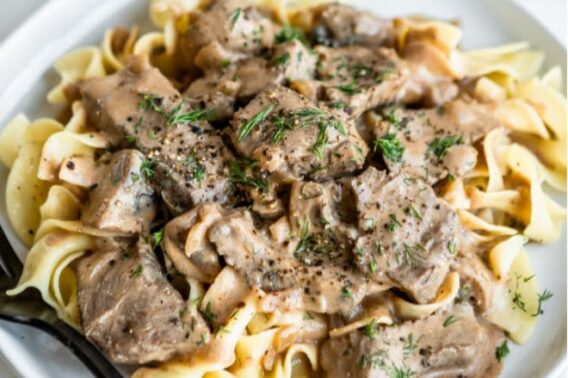 Easy beef stroganoff on a white plate.