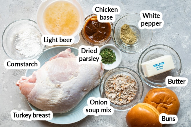 Labeled hot turkey sandwich ingredients in bowls.