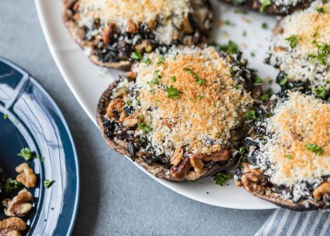 An easy recipe for Stuffed Portobello Mushrooms on a white platter.