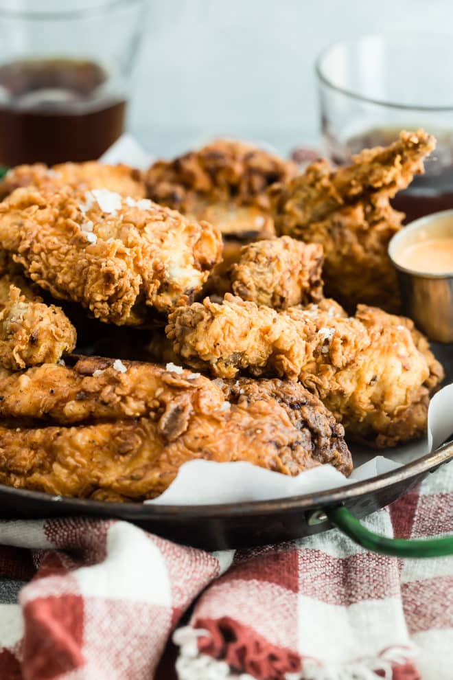 Fried chicken on a metal plate.
