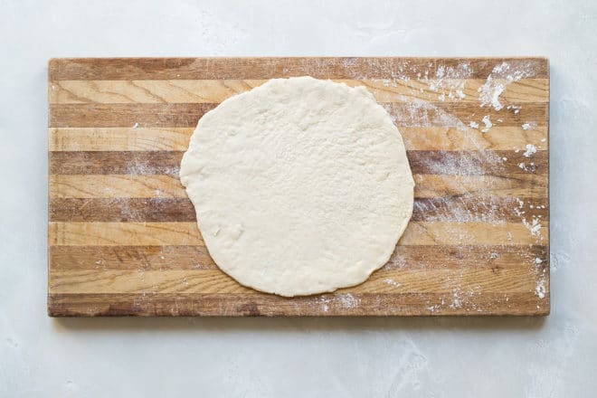 Get ready for the cheers when you learn how to make pizza dough from scratch. Not just any dough, mind you— authentic, chewy dough that tastes fabulous and cooks up in minutes. If your family is anything like my family, then everyone likes different ingredients on their pizza. This easy recipe for pizza dough solves the problem and lets everyone have their own pizza, just the way they want it.
