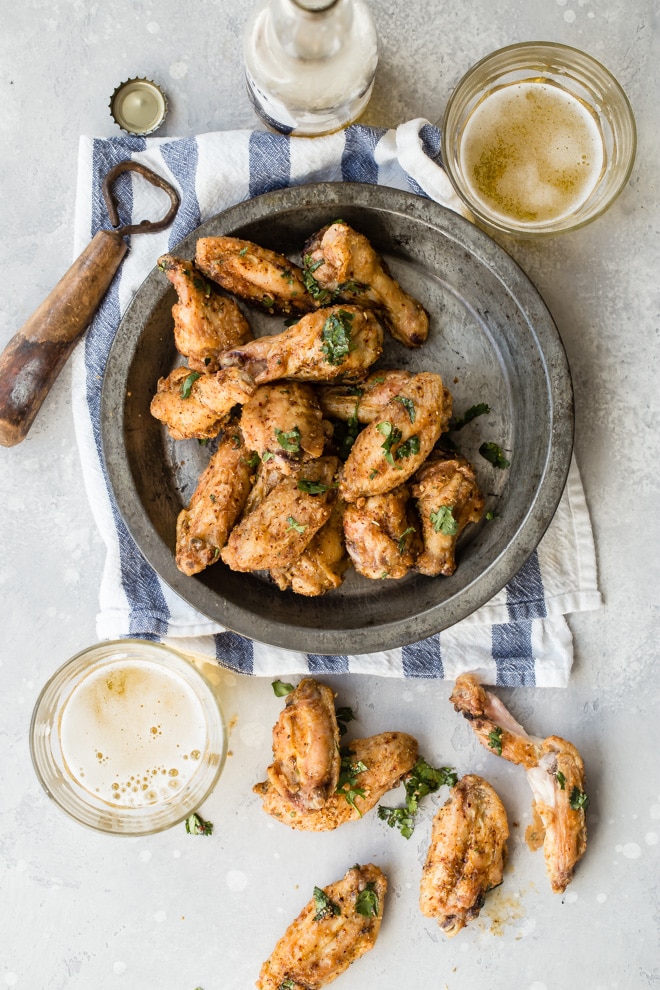 If you’re ready to up your game in the chicken wing department, and score big points with your home team, these oven-baked Chinese Chicken Wings are exactly what you should make for your next party. These are the best crispy baked chicken wings and they're tossed in a easy-to-make dry rub that’s bursting with spicy, smoky flavor. Skip the sauce, save your furniture, and take your tastebuds on the adventure of a lifetime.