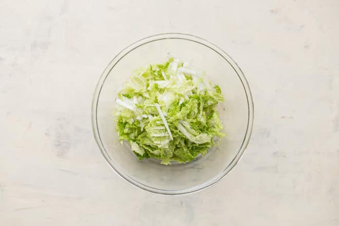 Cabbage in a clear glass bowl.