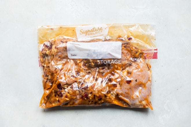 Chipotle chicken marinading in a Ziploc bag.