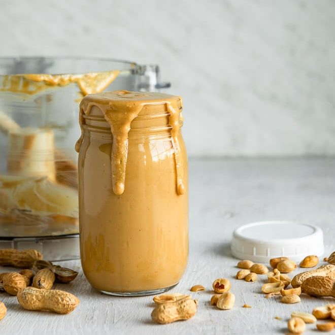 Homemade peanut butter in a mason jar.