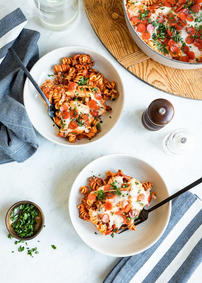 Pizza pasta bake in two white bowls.