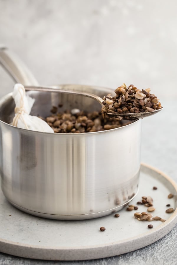 Lentils in a silver bowl.