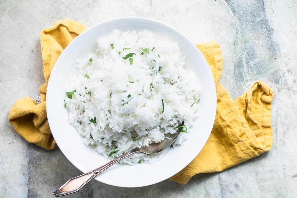 Learn the secrets to making Chipotle Cilantro Lime Rice in the comfort of your own kitchen. This copycat recipe starts with getting the right type of rice and cooking it in a non-traditional way. This rice is soft and fluffy with just the right amount of chew and no stickiness.