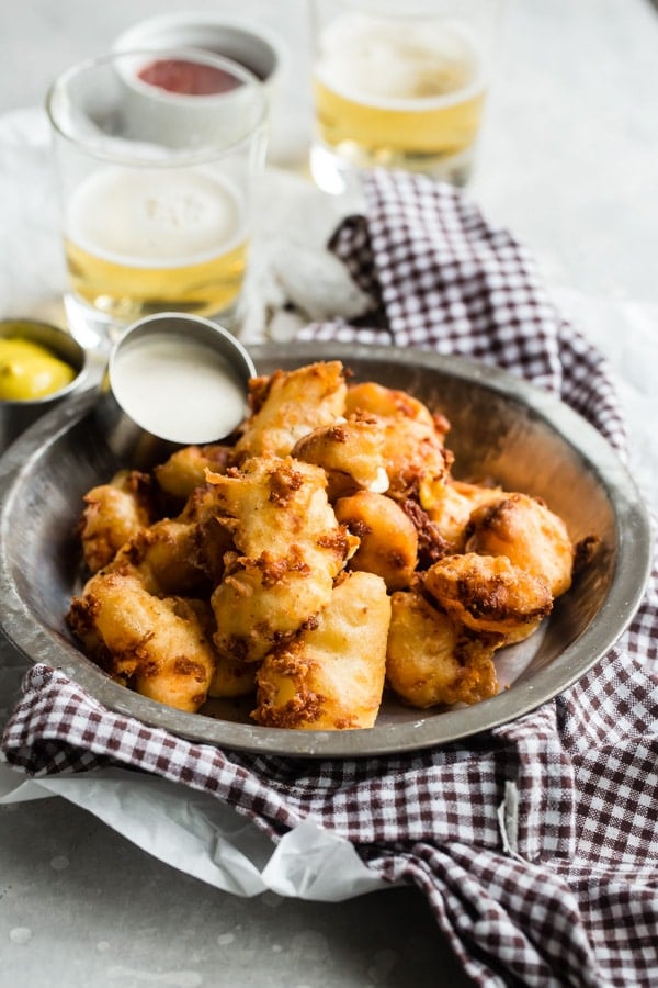 An easy recipe for deep fried cheese curds for anyone not fortunate enough to live in or near Wisconsin. These crispy little bites are legendary in America’s Dairyland!