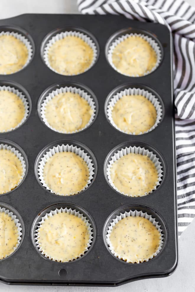 A vintage recipe with a modern twist, this Lemon Poppy Seed Muffin Recipe is made from scratch and topped with a sugar lemon glaze that will make your lips pucker in delight.