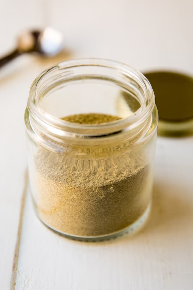 Homemade Poultry Seasoning recipe in a glass jar.