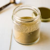 Homemade Poultry Seasoning recipe in a glass jar.
