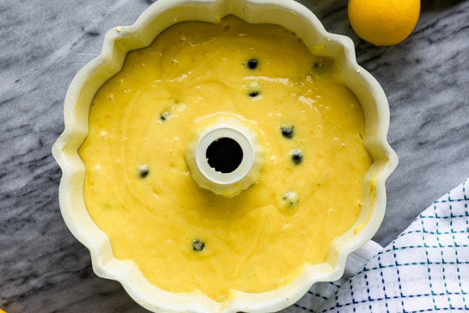 Lemon blueberry cake batter in a bundt pan.