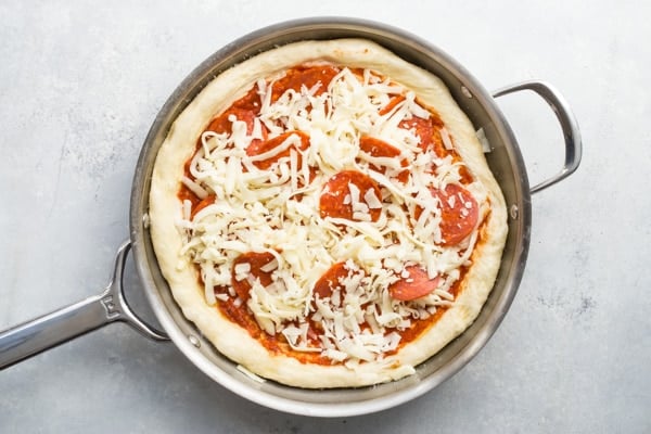 This recipe goes out to all the Pepperoni Pizza lovers in the world—you know who you are. This Pepperoni Pizza Recipe is a perfect homemade pizza that will make you think twice about delivery, featuring lots and lots of your favorite thing: pepperoni.