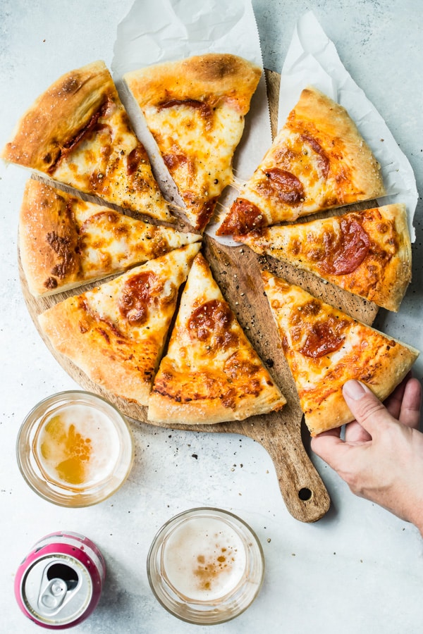 This recipe goes out to all the Pepperoni Pizza lovers in the world—you know who you are. This Pepperoni Pizza Recipe is a perfect homemade pizza that will make you think twice about delivery, featuring lots and lots of your favorite thing: pepperoni.