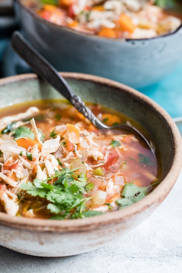 Mexican Chicken Soup in a bowl topped with fresh cilantro.