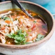 Mexican Chicken Soup in a bowl topped with fresh cilantro.