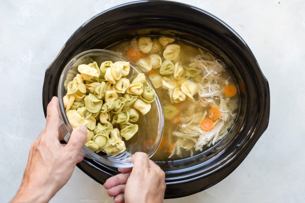 Quick comfort food to the rescue! Slow Cooker Chicken Tortellini Soup is everything a hearty fall soup should be, and it’s ready in a flash if you use an Instant Pot. Cheese filled tortellini take the place of dumplings for cheers all around, no matter who’s at the table or what the weather’s like.