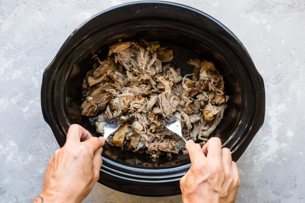 Everyone loves this genius 2-ingredient recipe for Slow Cooker Pulled Pork. Since there’s no pre-browning, it’s perfect for busy weeknights and long, delicious weekends… just throw it in and go.