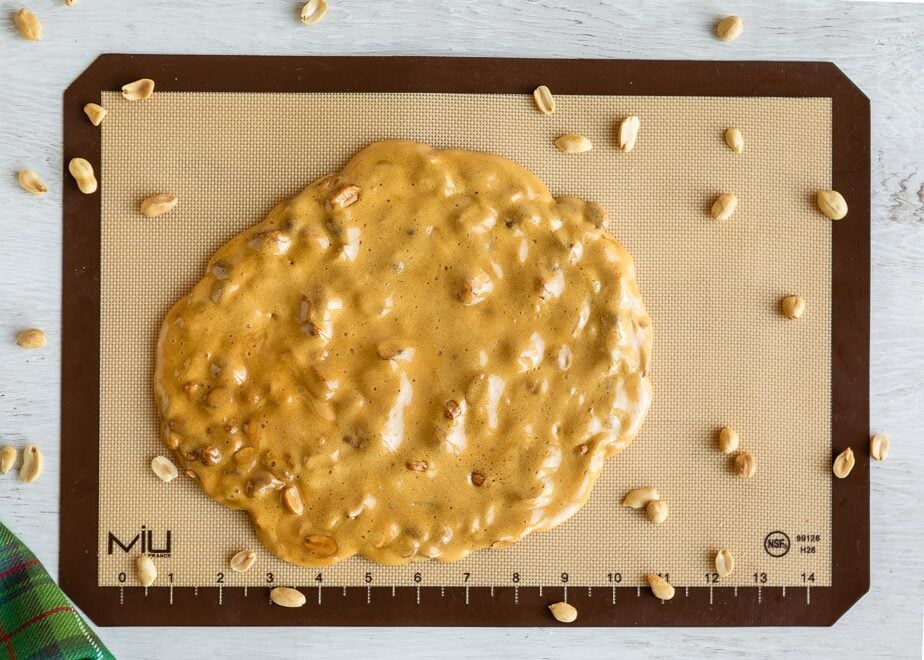 Microwave peanut brittle on a cutting board.