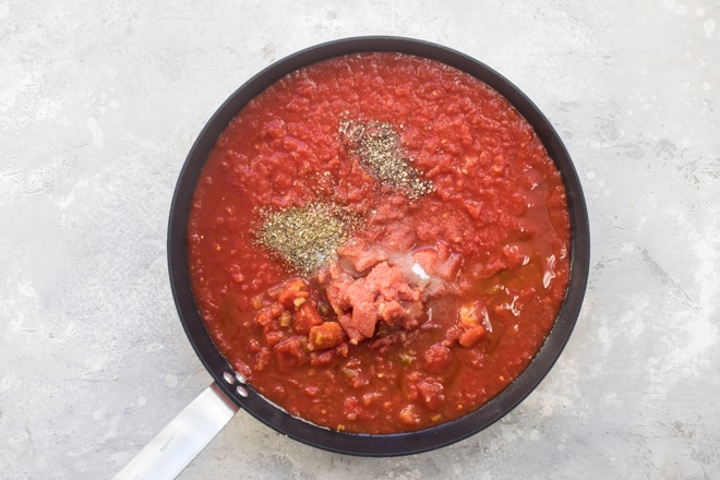 Quick tomato sauce in a black sauce pan.