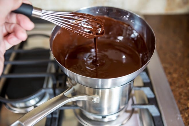 Chocolate and butter melted together on a stove top.