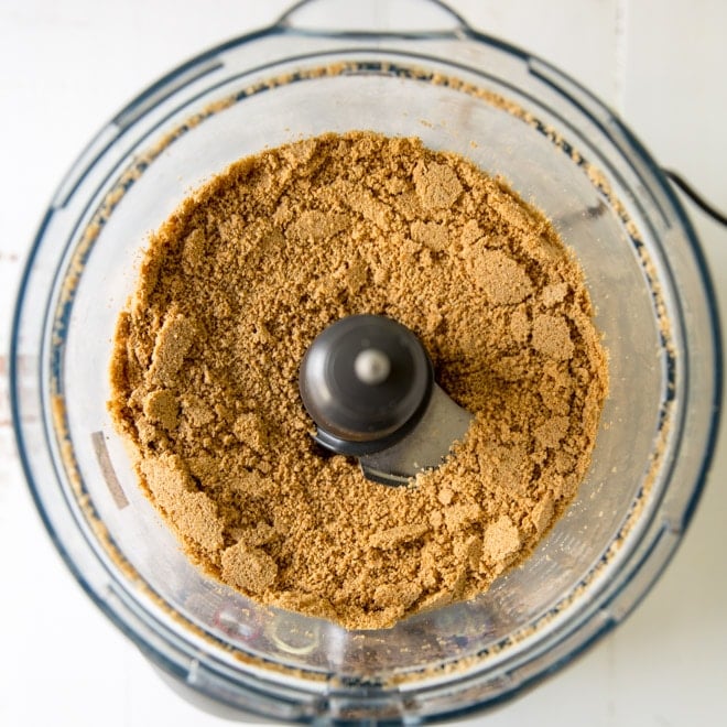 Sunflower seeds being ground in a food processor.