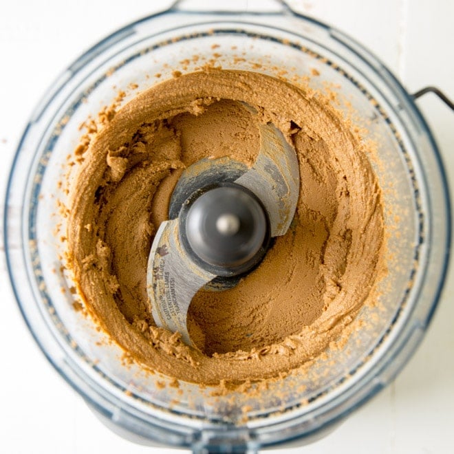 Sunflower butter being processed in a food processor.