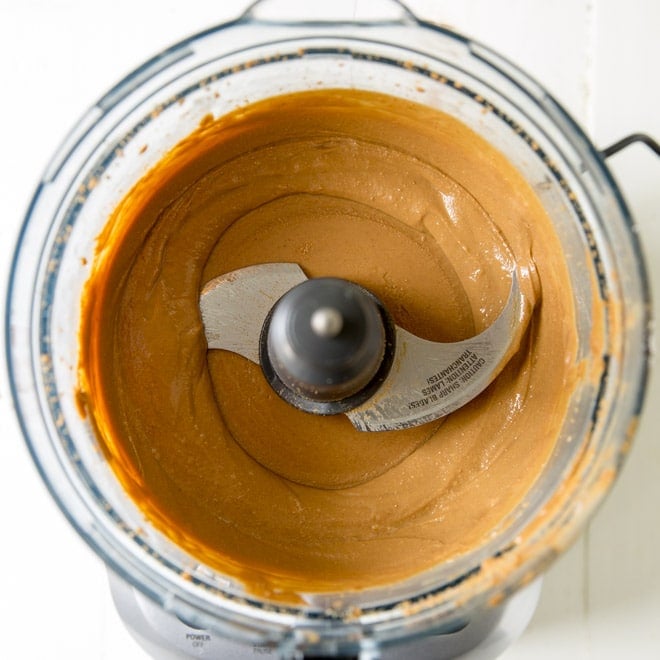 A close up of sunflower seed butter in a food processor.