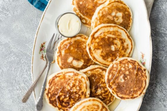 Vegan pancakes on a white platter.