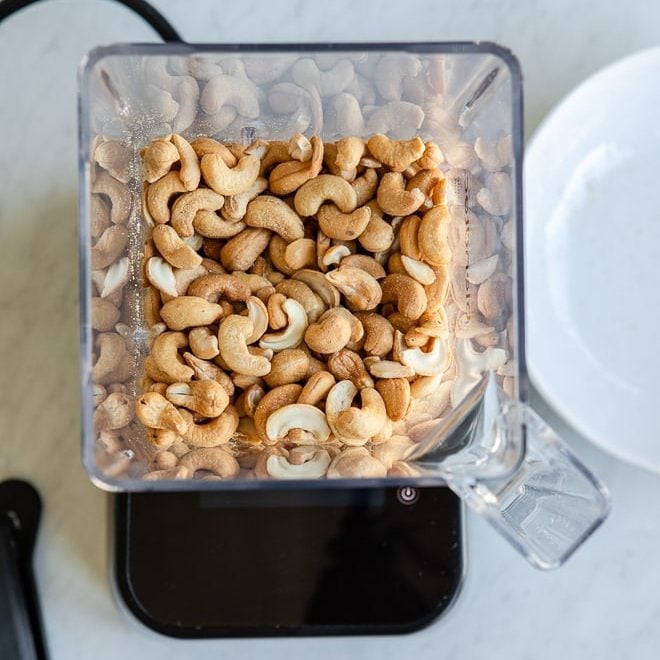 Whole cashews in a blender.
